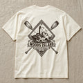 Lighthouse crest on the back of an ivory Woods Island Outfitters tee