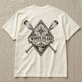 Compass crest on the back of an ivory Woods Island Outfitters tee